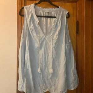 Blue and white sleeveless blouse